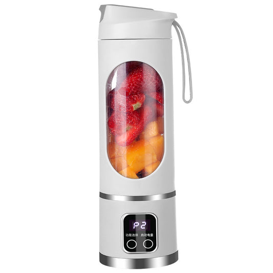 Portable blender with fruits inside on a white background